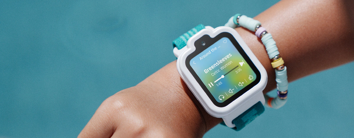 White TickTalk 6 kids smartwatch with a teal band worn on a wrist
