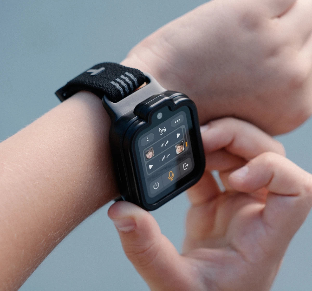 Child using voice messaging on a black TickTalk kids smartwatch, highlighting safe family communication